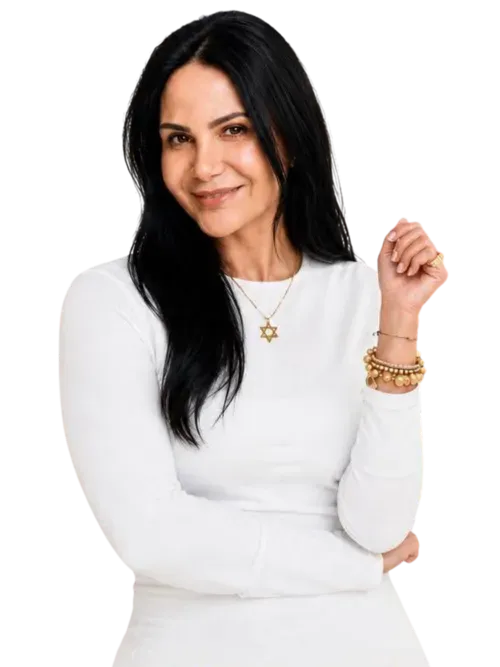 Mika Harris, Broker-Owner of SwanGate Real Estate Services, smiling in a white top