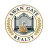 SwanGate Realty seal with a gated entry, gold swan, and laurel wreath